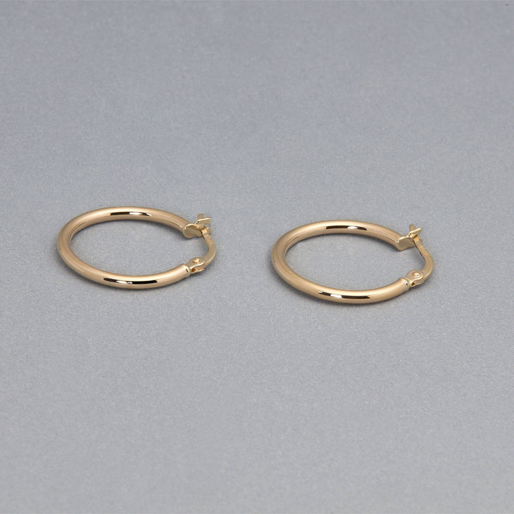 Stone and Strand 14K Yellow Gold Thin Gold Hoops 15mm Editorial Image