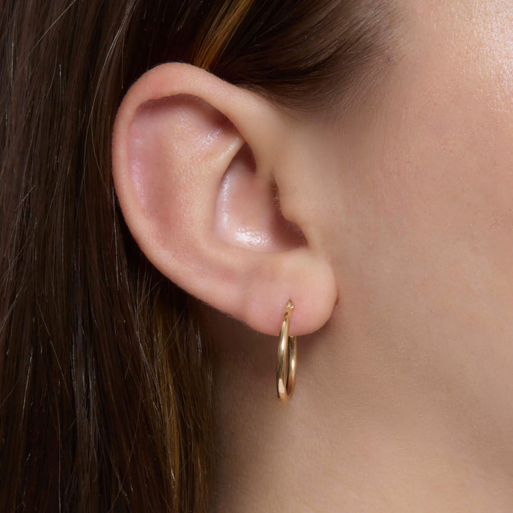 Image of 14K Yellow Gold Thin Gold Hoops 15mm on Models Ear