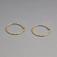 Stone and Strand 14K Yellow Gold Thin Gold Hoops 30mm Editorial Image