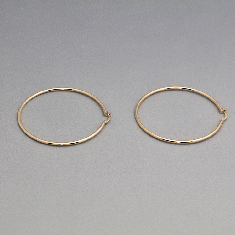 Stone and Strand 14K Yellow Gold Thin Gold Hoops 50mm Editorial Image