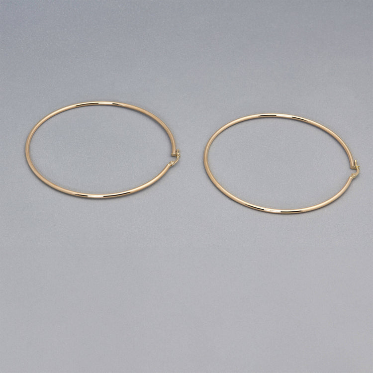 Stone and Strand 14K Yellow Gold Thin Gold Hoops 65mm Editorial Image