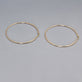 Stone and Strand 14K Yellow Gold Thin Gold Hoops 65mm Editorial Image