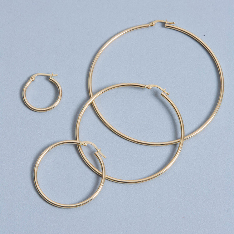 Stone and Strand 14K Yellow Gold Thin Gold Hoops Editorial Image
