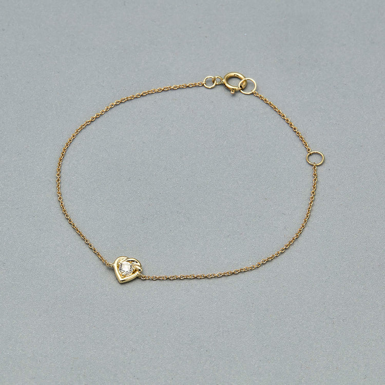 Stone and Strand 10K Yellow Gold Tie The Knot Diamond Bracelet Editorial Image