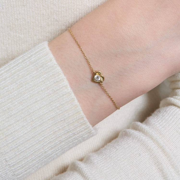 Image of 10K Yellow Gold Tie The Knot Diamond Bracelet on Models Arm