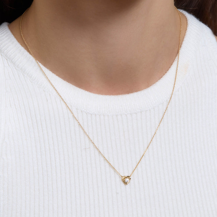 Image of 10K Yellow Gold Tie The Knot Diamond Necklace on Models Neck