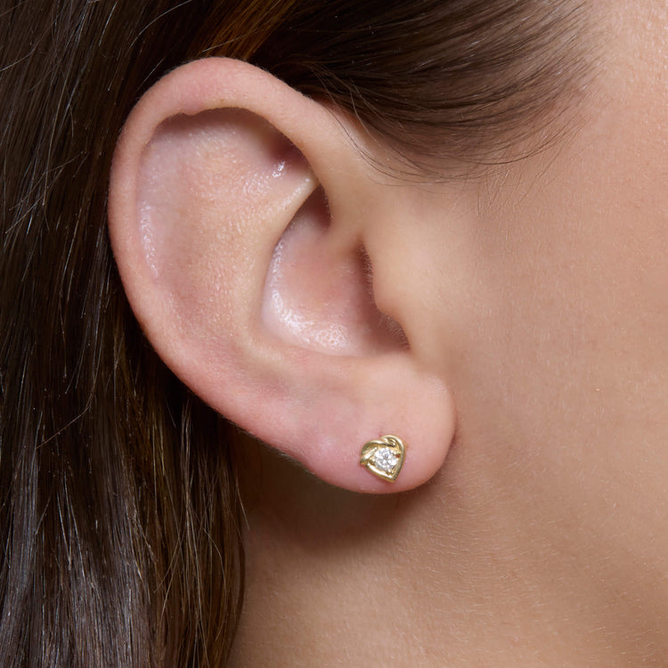Image of 10K Yellow Gold Tie The Knot Diamond Studs on Models Ear