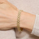 Image of 14K Yellow Gold Timepiece Bracelet on Models Hand