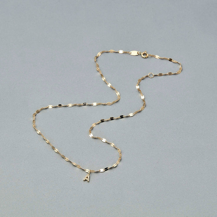 Stone and Strand 10K Yellow Gold Tiny Diamond Initial Sparkle Choker Editorial Image