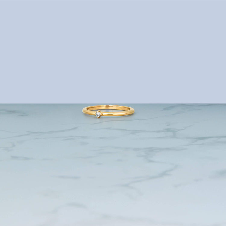Stone and Strand 14K Yellow Gold Tiny Diamond Ring Editorial Image