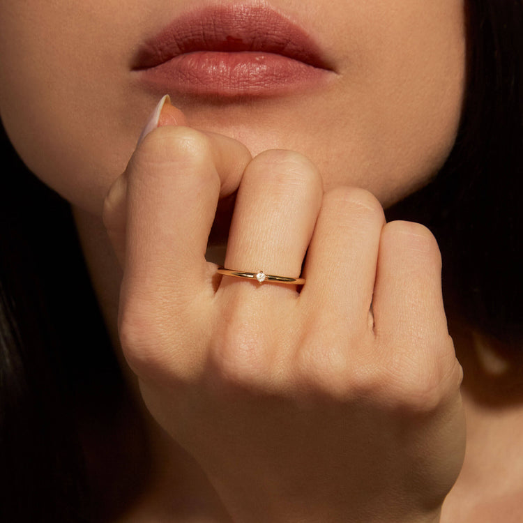 Image of 14K Yellow Gold Tiny Diamond Ring on Models Hand