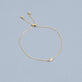 Stone and Strand 14K Yellow Gold Tiny Diamond Slider Bracelet Editorial Image