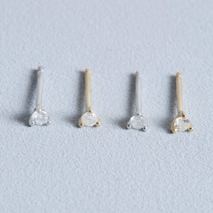 Stone and Strand 14K Yellow Gold and White Gold Tiny Diamond Stud Editorial Image