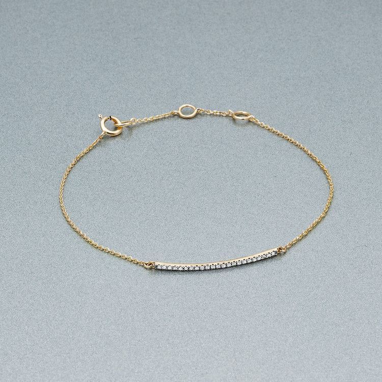 Stone and Strand 14K Yellow Gold Teeny Pave Diamond Bar Bracelet Editorial Image