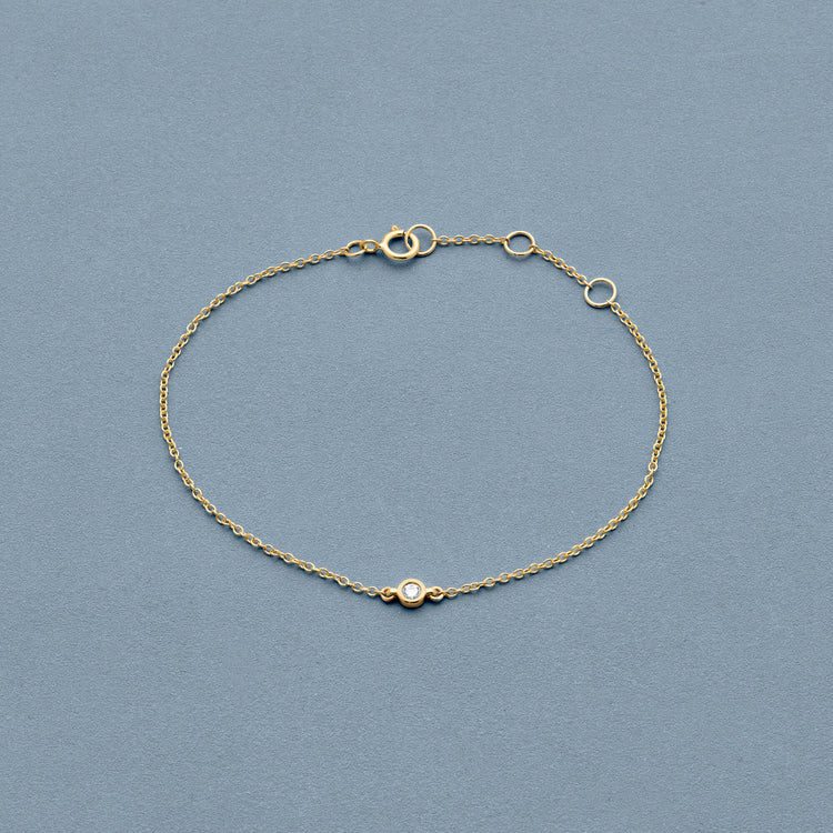 Stone and Strand 10K Yellow Gold Tiny Round Diamond Bracelet Editorial Image