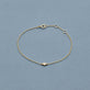 Stone and Strand 10K Yellow Gold Tiny Round Diamond Bracelet Editorial Image