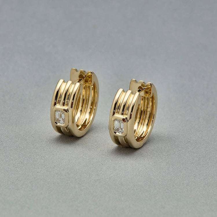 Stone and Strand 14K Yellow Gold Trio Ridge Diamond Huggies Editorial Image