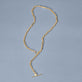 Stone and Strand 10K Yellow Gold Trombone Link Toggle Lariat Necklace Editorial Image