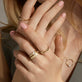 Image of 14K Yellow Gold Twist And Turn Ring with Stone and Strand Rings