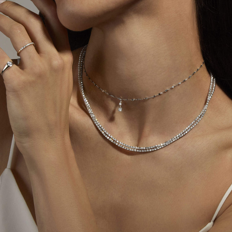 Model wearing Unflippable Tennis Necklace in White Gold with solid gold Stone and Strand jewelry