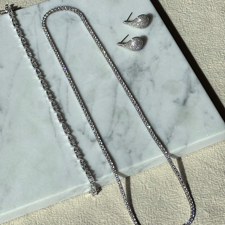 Still life image of Unflippable Tennis Necklace in White Gold with Stone and Strand solid gold jewelry