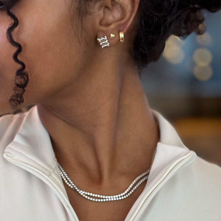 Model wearing Unflippable Tennis Necklace in White Gold with solid gold Stone and Strand jewelry