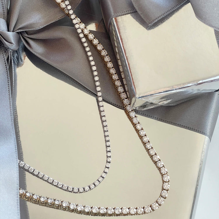 Still life image of Unflippable Tennis Necklace in White Gold with Stone and Strand solid gold jewelry
