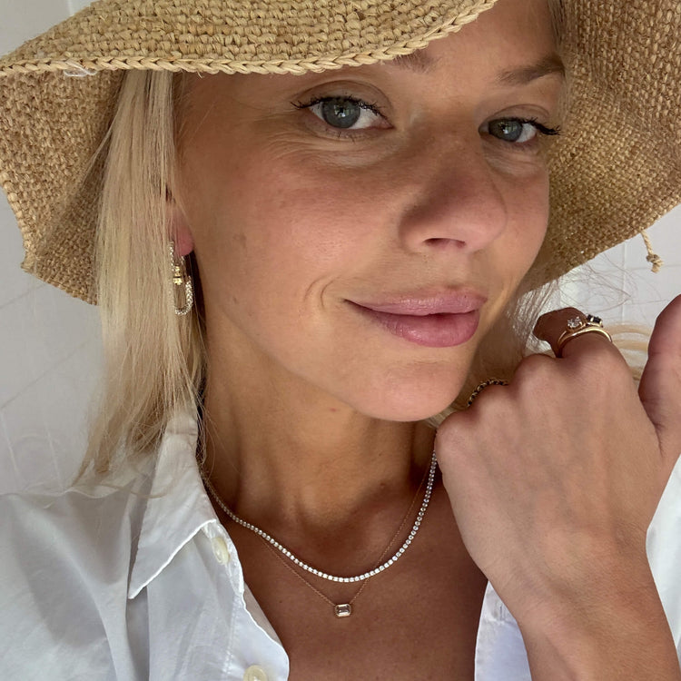 Model wearing Unflippable Tennis Necklace in Yellow Gold with solid gold Stone and Strand jewelry