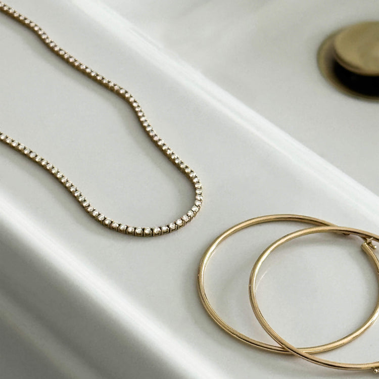 Still life image of Unflippable Tennis Necklace in Yellow Gold with Stone and Strand solid gold jewelry