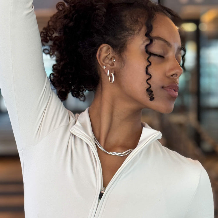 Model wearing Unflippable Tennis Necklace in Yellow Gold with solid gold Stone and Strand jewelry