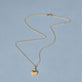 Stone and Strand 14K Yellow Gold Vintage Scallop Shell Necklace Editorial Image