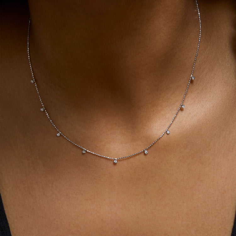 Image of 14K White Gold Teeny Dangling Diamond Bead Chain Necklace on Models Neck