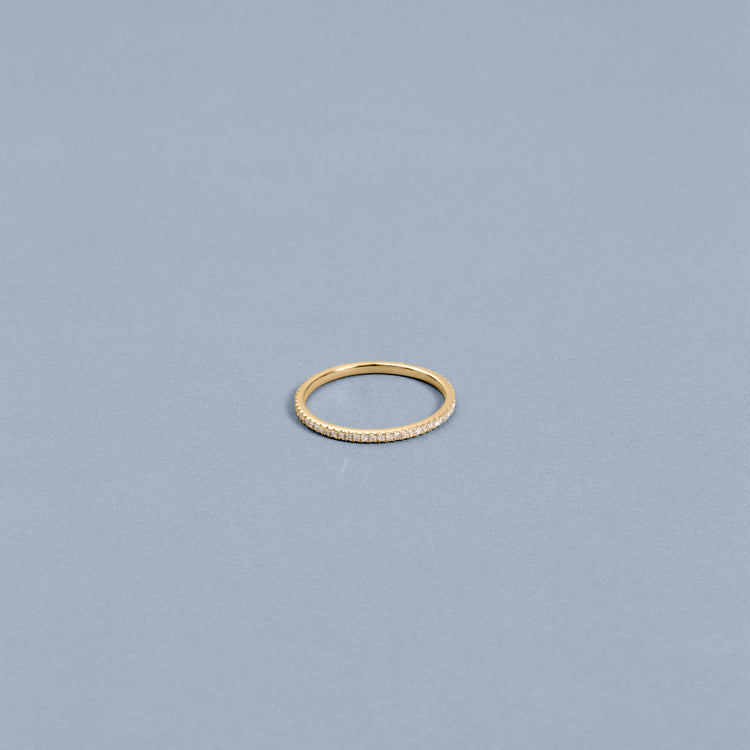 Stone and Strand 14K Yellow Gold White Diamond Pave Eternity Band Editorial Image