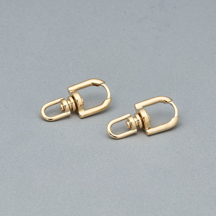 Stone and Strand 14K Yellow Gold Windlass Gold Earrings Editorial Image