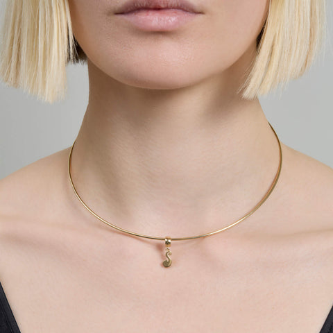 Image of 14K Yellow Gold Woodstock Initial Charm Necklace on Models Neck