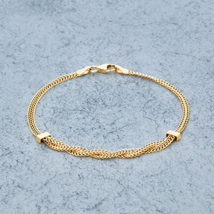 Stone and Strand 10K Yellow Gold Woven In Gold Braided Bracelet Editorial Image