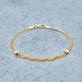 Stone and Strand 10K Yellow Gold Woven In Gold Braided Bracelet Editorial Image