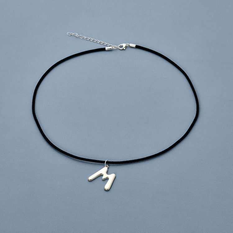 Stone and Strand Sterling Silver XL Silver Blob Initial Necklace Editorial Image