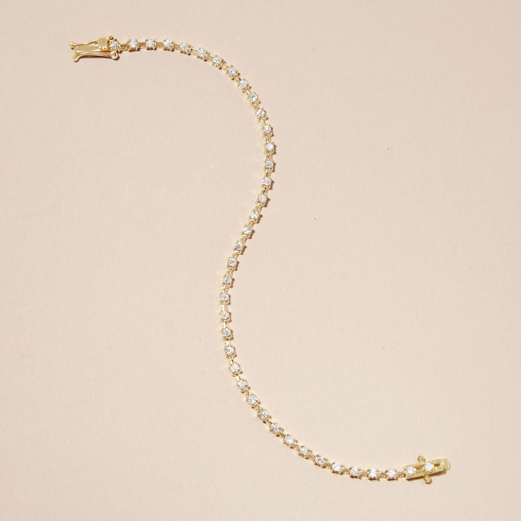 Stone and Strand 14K Yellow Gold Ace Diamond Tennis Bracelet Editorial Image