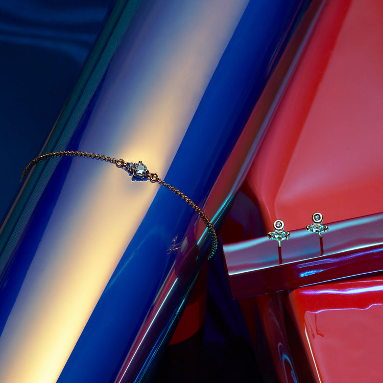 Still life image of Tiny Aquamarine and Sapphire Slider Bracelet with Stone and Strand solid gold jewelry