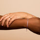 Model wearing Baby Pink BFFL Bracelet with solid gold Stone and Strand jewelry