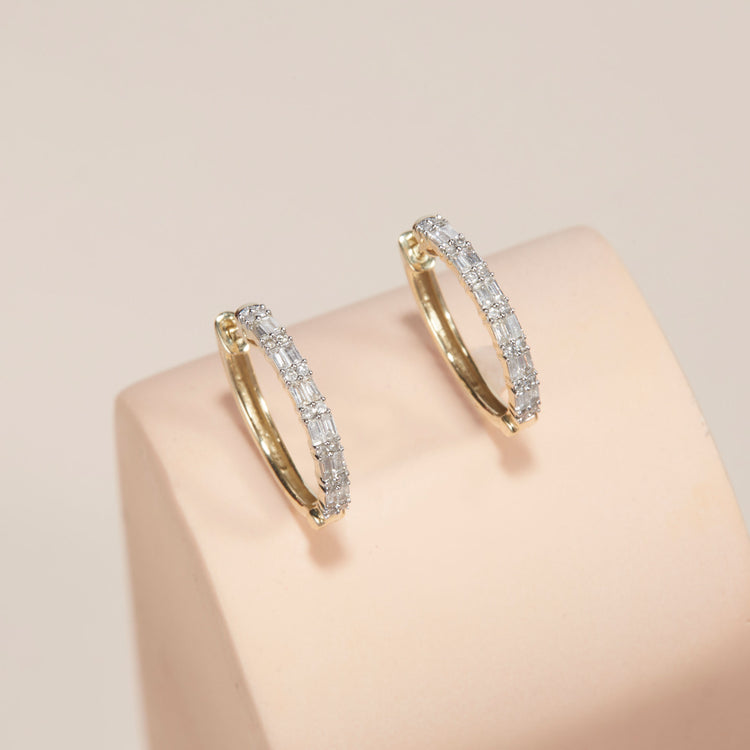Stone and Strand 10K Yellow Gold Diamond Code Huggies Editorial Image