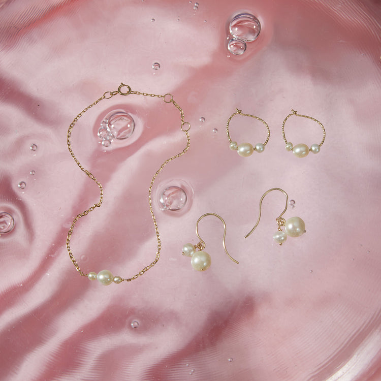 Still life image of Buddy Pearl Hook Earrings with Stone and Strand solid gold jewelry