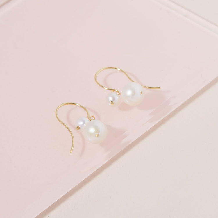 Stone and Strand 10K Yellow Gold Buddy Pearl Hook Earrings Editorial Image