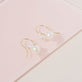 Stone and Strand 10K Yellow Gold Buddy Pearl Hook Earrings Editorial Image