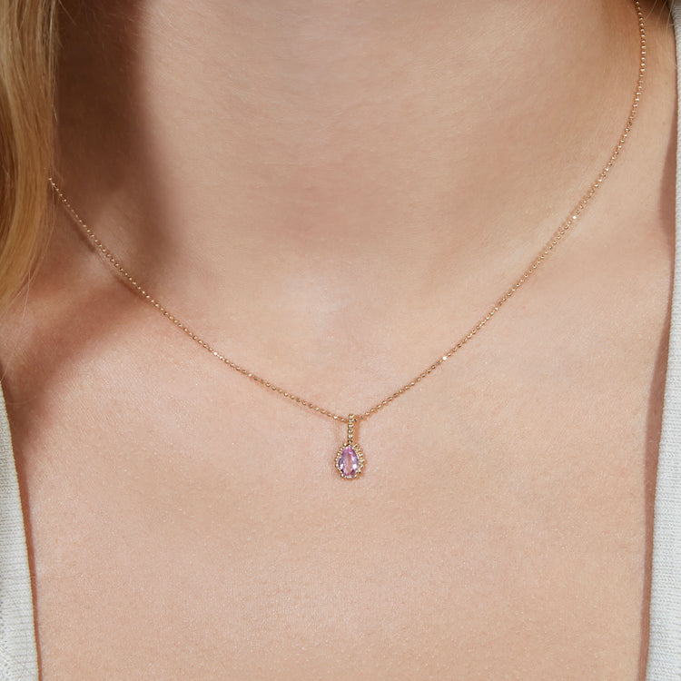 Image of 10K Yellow Gold Candy Berry Charm with Pink Topaz on Models Neck