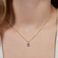 Image of 10K Yellow Gold Candy Tanzanite Charm on Models Neck