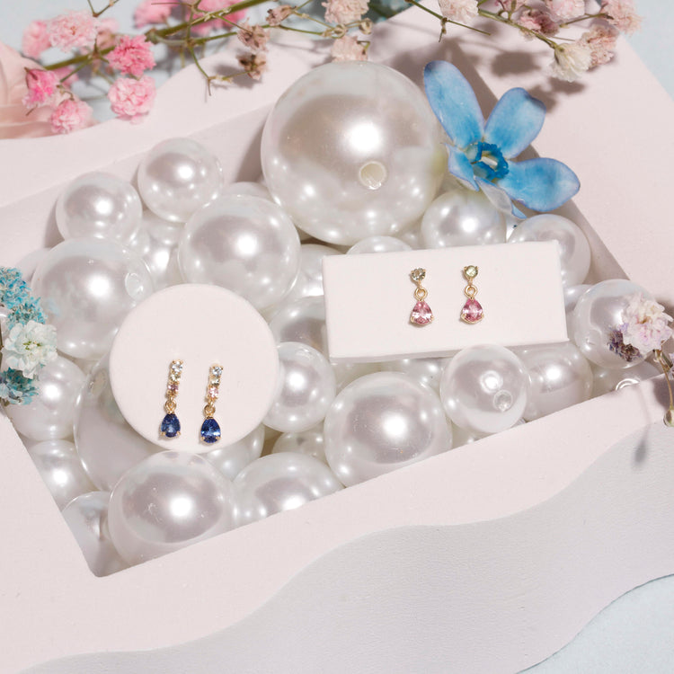 Still life image of Cotton Candy Drop Earrings with Stone and Strand solid gold jewelry