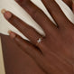 Image of 10K Yellow Gold Tiny Diamond Bow Ring on Models Hand