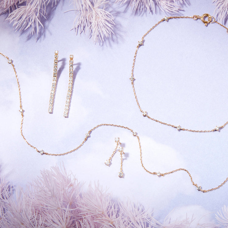 Still life image of Teeny Diamond Drizzle Drops with Stone and Strand solid gold jewelry